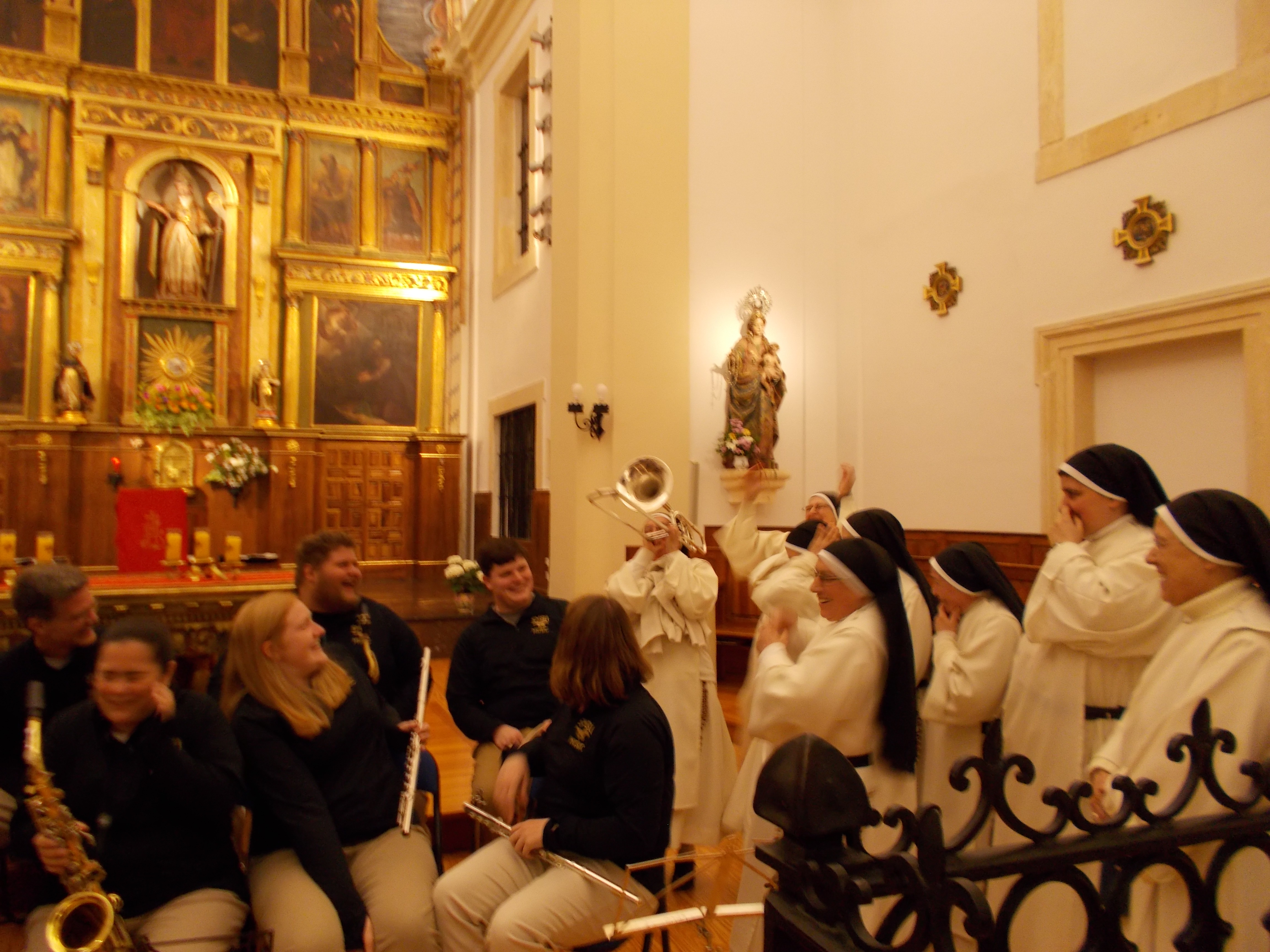 a nun trying out the trombone